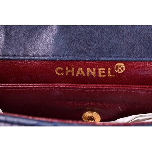 524 - Chanel. A classic quilted leather handbag, of tapered square design, with gold tone CC logo clasp, a... 