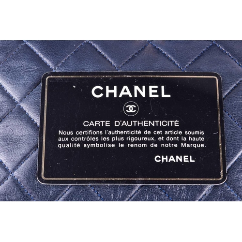 524 - Chanel. A classic quilted leather handbag, of tapered square design, with gold tone CC logo clasp, a... 