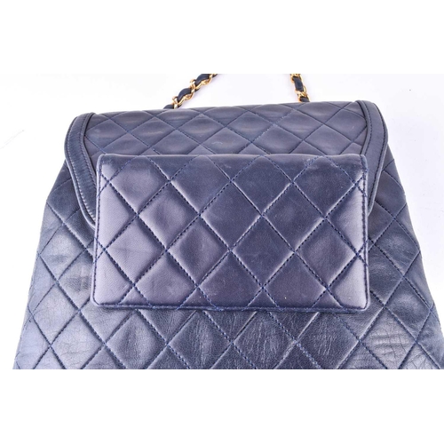 524 - Chanel. A classic quilted leather handbag, of tapered square design, with gold tone CC logo clasp, a... 