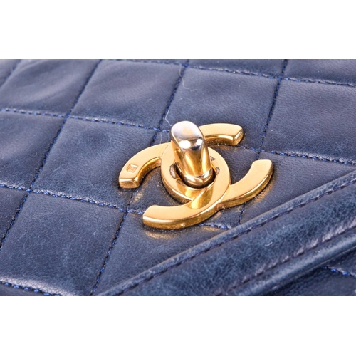 524 - Chanel. A classic quilted leather handbag, of tapered square design, with gold tone CC logo clasp, a... 