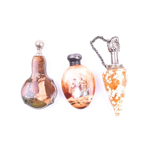 525 - A white metal mounted shell scent bottle 8.4 cm long, together with a white metal and hardstone scen... 