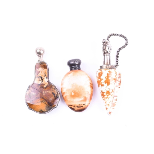 525 - A white metal mounted shell scent bottle 8.4 cm long, together with a white metal and hardstone scen... 