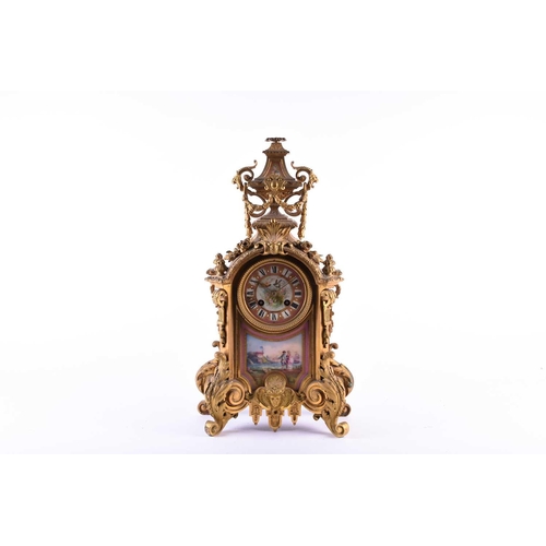 528 - A 19th century French ormolu mantel clock, surmounted by a vase with bellflower swags and lion masks... 