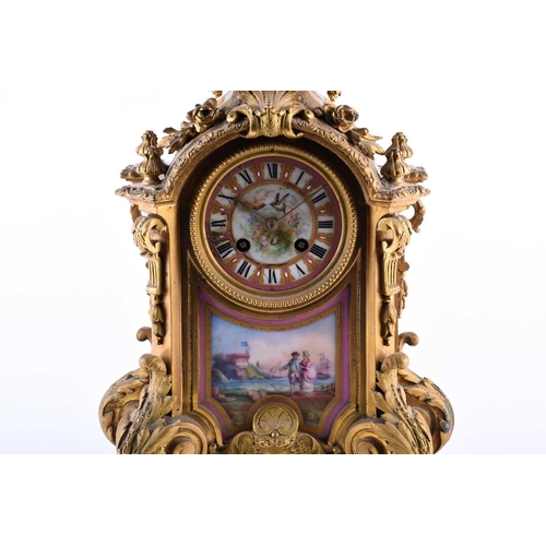 528 - A 19th century French ormolu mantel clock, surmounted by a vase with bellflower swags and lion masks... 