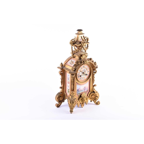 528 - A 19th century French ormolu mantel clock, surmounted by a vase with bellflower swags and lion masks... 