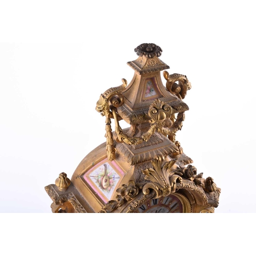 528 - A 19th century French ormolu mantel clock, surmounted by a vase with bellflower swags and lion masks... 