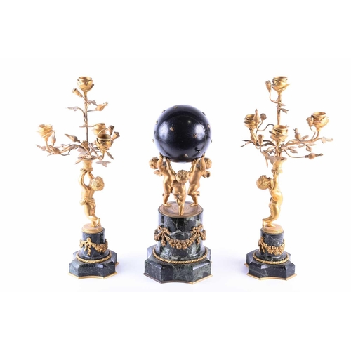 529 - A French gilt metal and marble clock garniture, late 19th century, the clock as a celestial sphere w... 