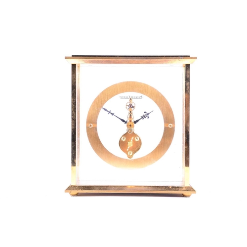 534 - A Jaeger-Le Coultre brass mantel or desk clock, of square form with suspended circular chapter ring ... 