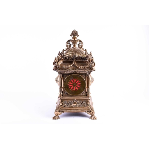 536 - A large and elaborate Victorian brass mantel clock, the dial with Roman numerals and with eight day ... 