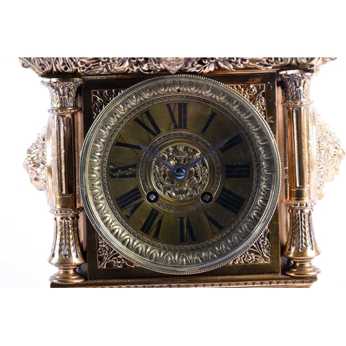 536 - A large and elaborate Victorian brass mantel clock, the dial with Roman numerals and with eight day ... 