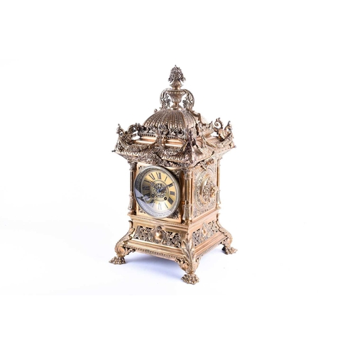 536 - A large and elaborate Victorian brass mantel clock, the dial with Roman numerals and with eight day ... 