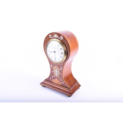 537 - An Art Nouveau mahogany balloon-cased mantel clock, with inlaid brass and mother-of-pearl marquetry,... 