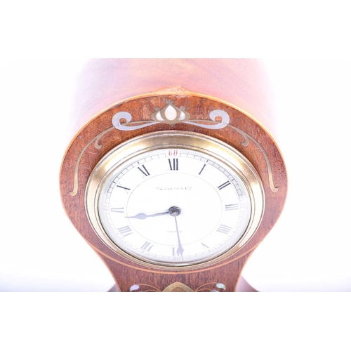 537 - An Art Nouveau mahogany balloon-cased mantel clock, with inlaid brass and mother-of-pearl marquetry,... 