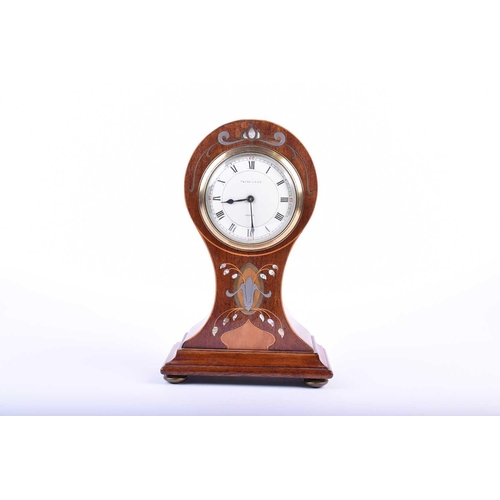 537 - An Art Nouveau mahogany balloon-cased mantel clock, with inlaid brass and mother-of-pearl marquetry,... 