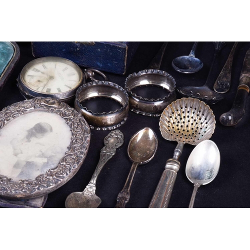 548 - A collection of mixed silver, silver plate and white metal items, to include napkin rings, cased tea... 