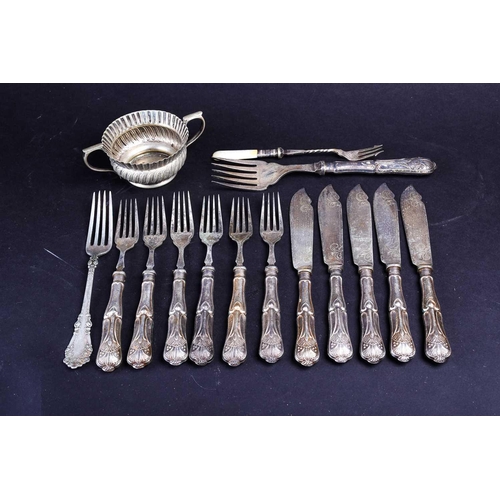 568 - A group of silver-handled flatware, together with a Continental silver plated twin-handled cup.