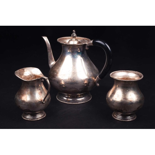 570 - A Continental white metal three-piece teaset, marked 'Silver', comprising teapot, sucrier and creame... 