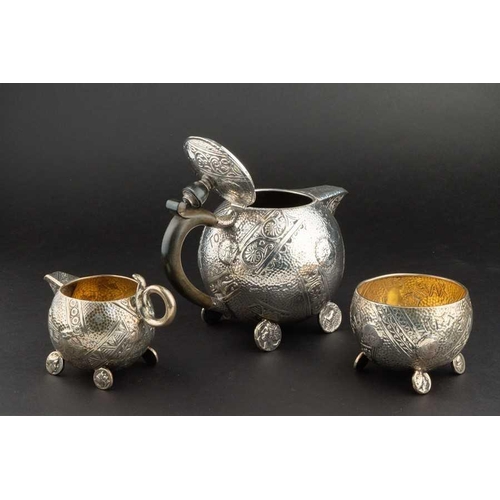 571 - A Victorian silver Aesthetic style three piece tea set Birmingham 1900, by Elkington and Co., compri... 