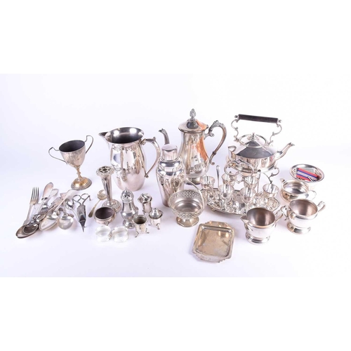 577 - A collection of silver plated items, to include a cocktail shaker, spirit kettle on stand, egg set o... 