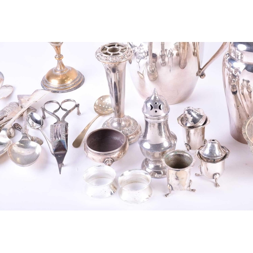 577 - A collection of silver plated items, to include a cocktail shaker, spirit kettle on stand, egg set o... 