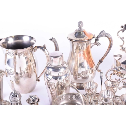 577 - A collection of silver plated items, to include a cocktail shaker, spirit kettle on stand, egg set o... 