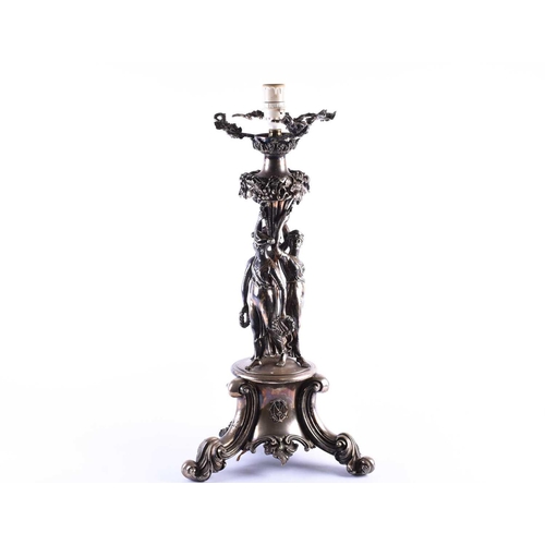 578 - An Victorian silver plated figural lamp of imposing proportions, with grape and vine decoration over... 