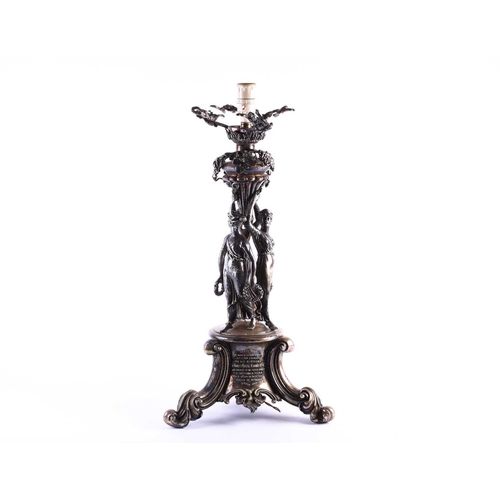 578 - An Victorian silver plated figural lamp of imposing proportions, with grape and vine decoration over... 