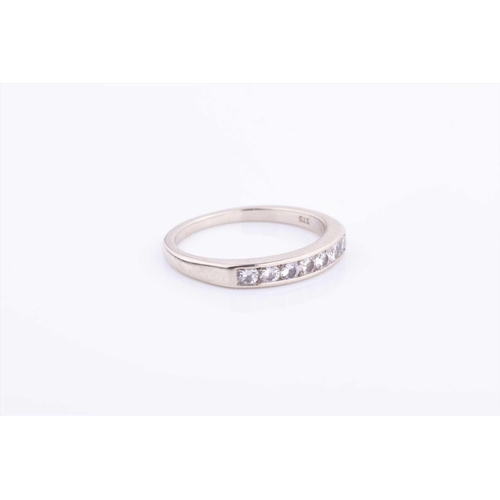 579 - A 9ct white gold and diamond half eternity ring size L 1/2, 2 grams.