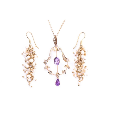 583 - An Edwardian amethyst and seed pearl negligee pendant, the principle oval cut amethyst within a seed... 