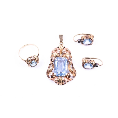 594 - A blue topaz dress suite, the pendant with a rectangular cut-cornered topaz in two colour pierced an... 