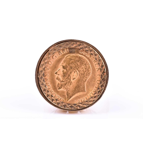 600 - A 9ct yellow gold half sovereign ring, in bright-cut mount, depicting George V (date indistinct due ... 