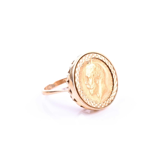 600 - A 9ct yellow gold half sovereign ring, in bright-cut mount, depicting George V (date indistinct due ... 