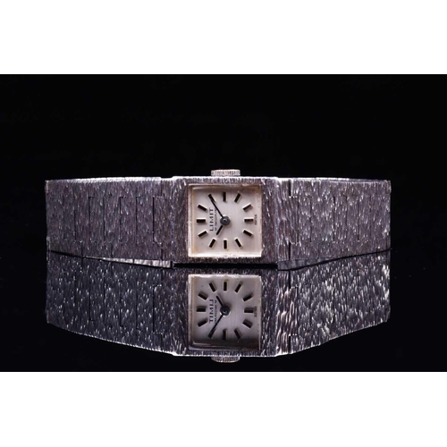 603 - A Limit of Switzerland ladies silver wristwatch, the square dial with baton markers, on a textured s... 