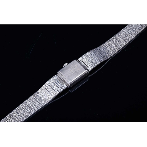 603 - A Limit of Switzerland ladies silver wristwatch, the square dial with baton markers, on a textured s... 