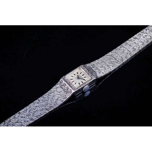 603 - A Limit of Switzerland ladies silver wristwatch, the square dial with baton markers, on a textured s... 