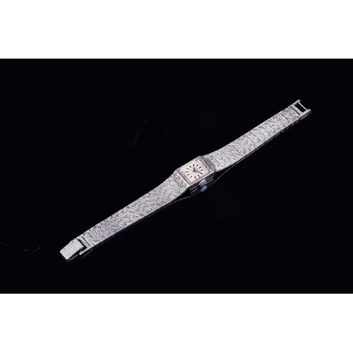 603 - A Limit of Switzerland ladies silver wristwatch, the square dial with baton markers, on a textured s... 