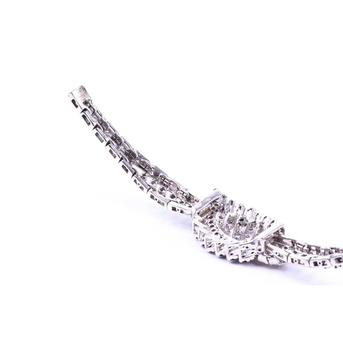 605 - A white metal, diamond, and sapphire bracelet, the swept central segment set with round brilliant-cu... 