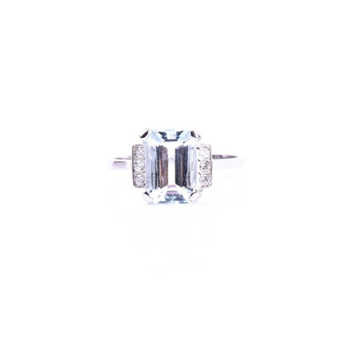 606 - A platinum, diamond, and aquamarine ring, set with an emerald-cut aquamarine of approximately 2.55 c... 