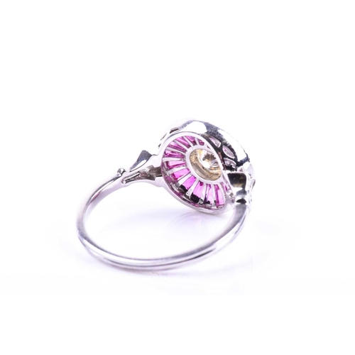 608 - A diamond and ruby target ring, in the Art Deco style, centred with a round brilliant-cut diamond, o... 