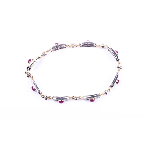 612 - An 18ct yellow gold, diamond, and ruby bracelet, the oval panels each collet-set with a cabochon rub... 