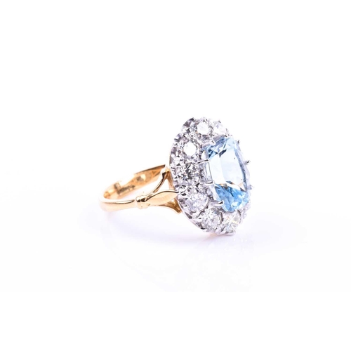 613 - An 18ct yellow gold, diamond, and aquamarine ring, set with a mixed rectangular cushion-cut aquamari... 