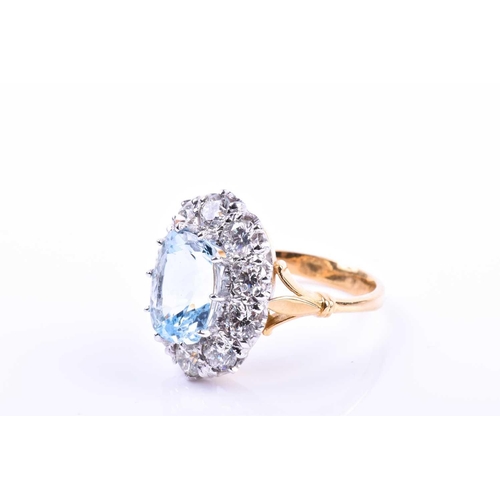 613 - An 18ct yellow gold, diamond, and aquamarine ring, set with a mixed rectangular cushion-cut aquamari... 