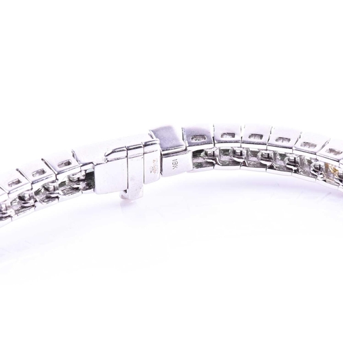 619 - An 18ct white gold and rainbow sapphire bracelet, set with multi-coloured sapphires ranging from gre... 