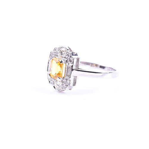 626 - A platinum, diamond, and yellow sapphire ring, in the Art Deco style, set with a mixed-cut sapphire ... 