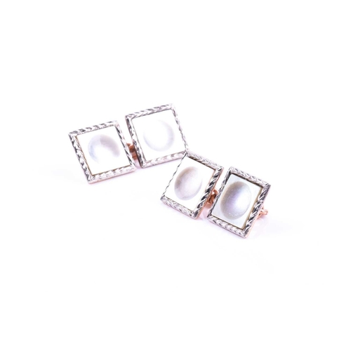 627 - A pair of 9ct rose gold and mother-of-pearl cufflinks, of matched square design, 5.6 grams.