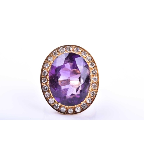 628 - A mid 20th century 18ct yellow gold, diamond, and amethyst cocktail ring, set with a mixed oval-cut ... 