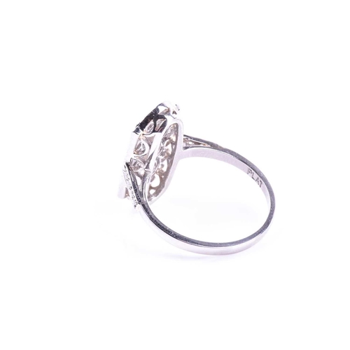 629 - A platinum and diamond ring, in the Art Deco style, the lozenge-shaped plaque ring inset with three ... 