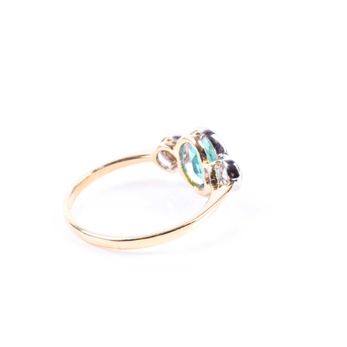 630 - An 18ct yellow gold, diamond, and emerald ring, collet-set with a mixed oval-cut emerald of approxim... 