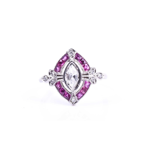 632 - A diamond and ruby ring, set with a marquise-shaped diamond of approximately 0.40 carats, within an ... 