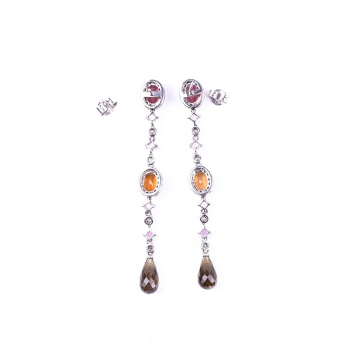 635 - A pair of diamond, sapphire, and tourmaline drop earrings, set with a mixed oval-cut pink tourmaline... 